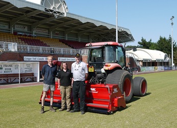 Paul and Amy Davies of Shape Wright Services with Gary Mumby and the 3m BLEC Multiseeder at Llanelli Stadium - Copy