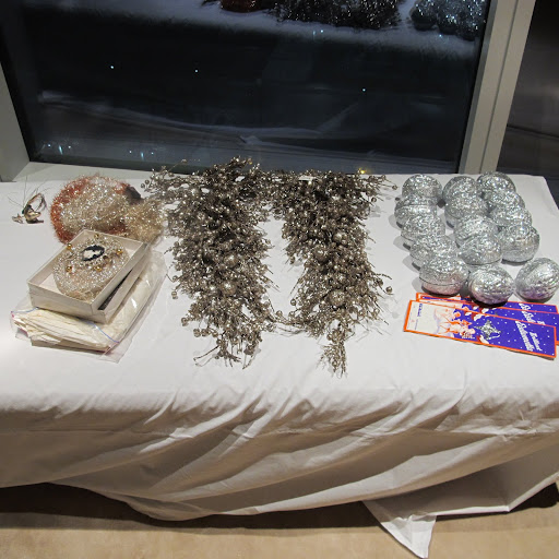 I covered my couch and chairs with sheets to protect them from the massive amount of glitter on the ornaments.