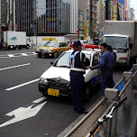 somebody getting a ticket in akihabara by the tokyo police in Akihabara, Japan 
