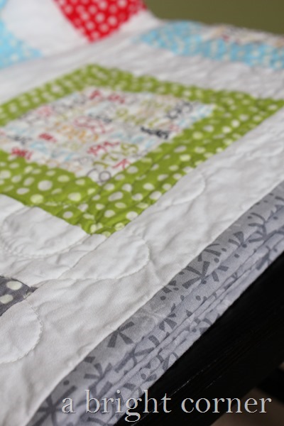 fun and bright throw quilt by A Bright Corner