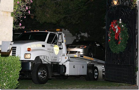 A silver BMW car matching a description of the one used by Michael Jackson's physician Conrad Murray is towed away from the home of the late pop icon in Los Angeles on June 25, 2009. Conrad Murray, a cardiologist believed to be the only person with Jackson when he died, met for a second time with the Los Angeles Police Department in the presence of a lawyer on June 27 although through a spokeswoman he said that he was not a suspect and that he spent hours comforting the King of Pop's family. Murray, 51, is believed to have an unblemished disciplinary record. However, his car was impounded and towed away from Jackson's rented mansion after his death. AFP PHOTO/VALERIE MACON (Photo credit should read VALERIE MACON/AFP/Getty Images)