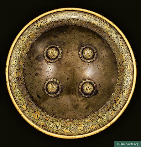 A GOLD-OVERLAID WATERED-STEEL SHIELD A GOLD-OVERLAID WATERED-STEEL SHIELD