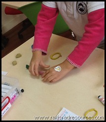 Teach economic principles like supply and demand and value to elementary school students with the game Snakes and Donuts