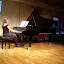 Showing at the piano how Messiaen depicts their calls and songs in the music