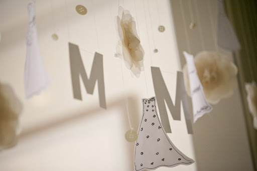 I sketched little dresses to hang on the garland along with the letter M, buttons, and flowers. Paper for the decorations is from Paper Presentation. I sketched little dresses to hang on the garland along with the letter M, buttons, and flowers. Paper for the decorations is from Paper Presentation.
