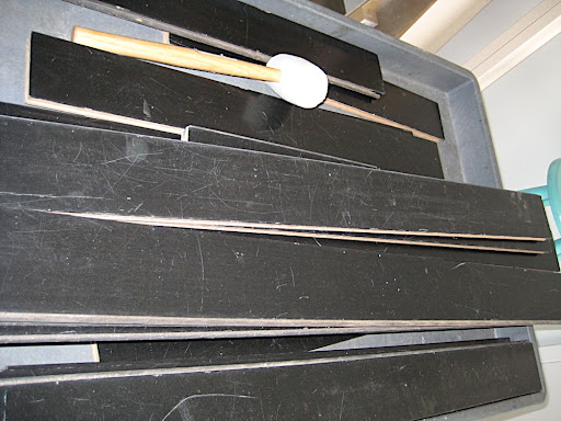 This is our black floor. We have a whole hallway of floor boards and they roll them into the studio on a cart to assemble in front of our set.