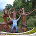 Hubby posing with Kublai statues praising the skies in Agong House area at Kapatagan