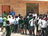 Woody (one of the new PCVs in our village) and one of the library helpers acted as bouncers to control the crown while they waited their turn in the new school library. South Africa - 473.jpg