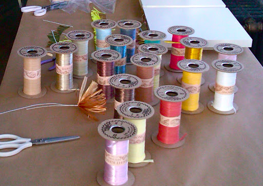 We ordered colorful rolls of raffia from Raffit Ribbons to make fringy flowers.