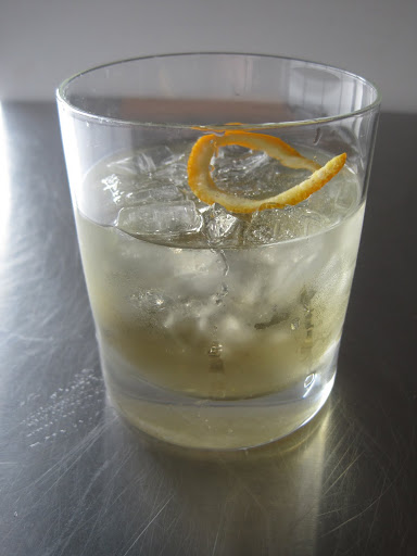 Pour a few ounces of chilled Lillet over ice, top with a splash of seltzer, and garnish with an orange twist. Et voilà!