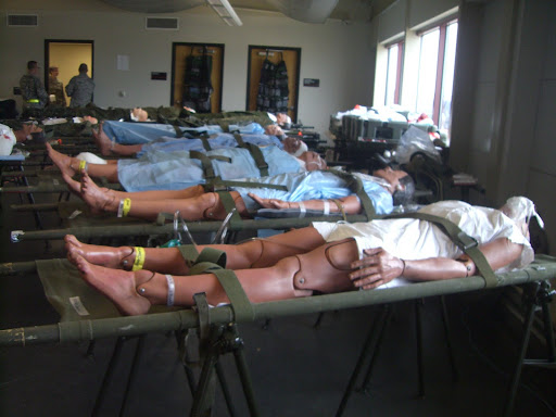 Mannequins, simulating injured patients after a catastrophe, line the medical prep room after arriving from local hospitals in ambulances. (Photo credit: Jennifer Moore)