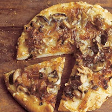 Wild Mushroom Pizza with Caramelized Onions, Fontina, and Rosemary