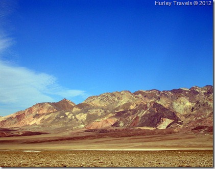 Another Death Valley scene: Wind and rain wash the dry lake bed into the little towers of salt on the floor of the valley in the foreground of this photo, looking across at another beautiful mountain scene. Devil's Golf Course view.