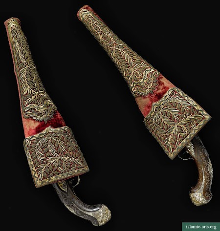 A PAIR OF OTTOMAN SILVER GILT AND WIRE-INLAID PISTOLS WITH METAL THREAD-EMBROIDERED SADDLE HOLSTERS, TURKEY