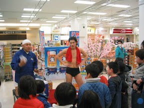 Things you don't see in the US: A man in his skivvies hawking beer coupons and beer mugs to kids