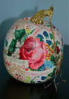 Janette Barber, executive producer for Rosie Radio, decorated with decoupage, using antique wallpaper saved from the farmhouse where she grew up. The big rose was on the walls of her room.