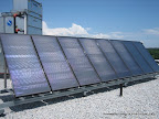 On top of the Edward Building on picton.  Eight 4 foot x 8 foot solar hot water modules installed in 2009.