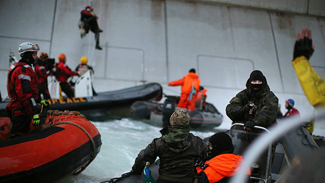 Russian special forces arrest Greenpeace activists protesting against Arctic oil drilling at a platform owned by the state-controlled energy company Gazprom on 26 September 2013. Photo: Greenpeace