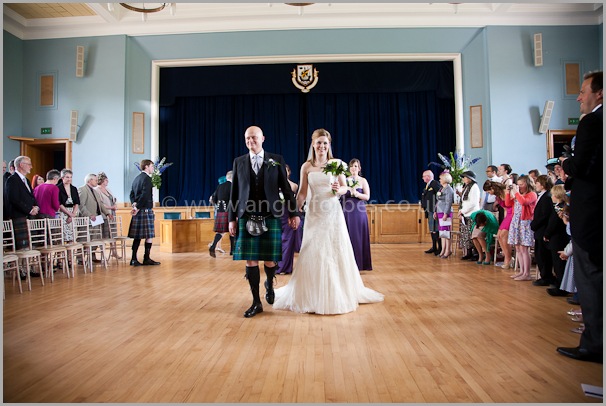 bride and groom leave the service at a scottish wedding