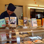 convey belt sushi chef in Shinjuku, Tokyo, Japan