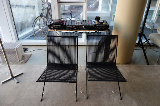 I set-up a DJ booth in the corner of the living room so there would be plenty of great music. I just had to move the chairs in a bit and all was fine. Notice the ice cubes I put on the floor where the chairs had left indentations. They are the quickest way to remove them.
