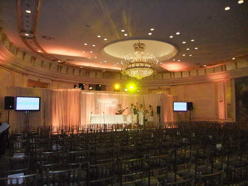Here, the band, Carte Blanche, does a sound check before the event starts.
