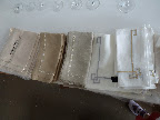 An array of Kim Seybert napkins, all of which had metallic thread detailing.