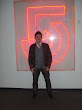 Asian Playboy In Front Of The Channel 5 Logo 2