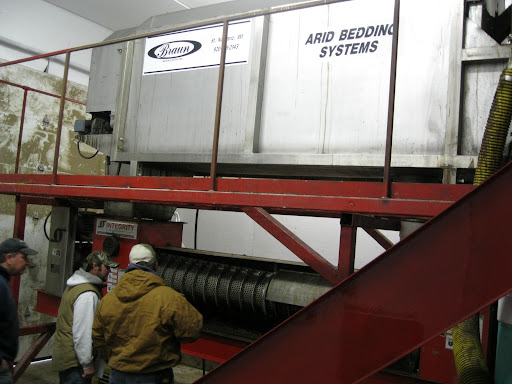 Primary separator positioned over top of hi-solids press