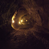a tunnel made in rock by flowing lava