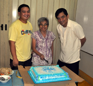 Sir Ervin Ruiz Reyes, Ma'am Remedios Esposa and Sir Jojo Esposa Jr. cuts the Anniversary Cake.