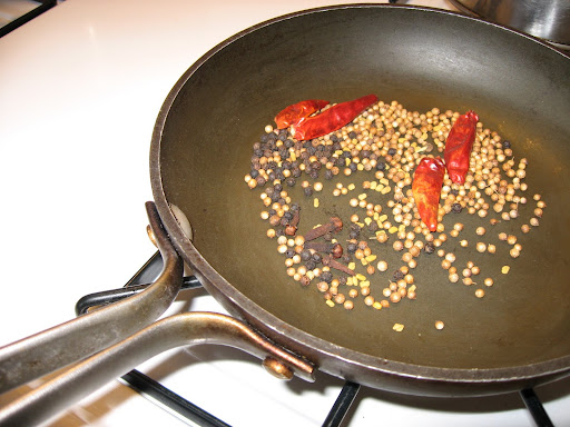 For the lamb madras curry, one of our main dishes, we toasted dried chiles, fennel, fenugreek and coriander seeds, and cloves in a skillet and then ground them in my coffee grinder. We coated the cubed lamb shoulder in the mixture and then marinated the meat for a few hours.