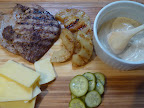 Sandwich ingredients-pork cutlet, pineapple, chile-lime-mayo, aged Cheddar and bread-and-butter pickles.
