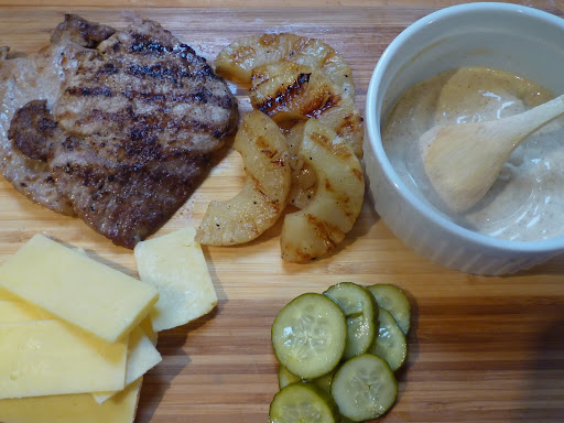 Sandwich ingredients-pork cutlet, pineapple, chile-lime-mayo, aged Cheddar and bread-and-butter pickles.