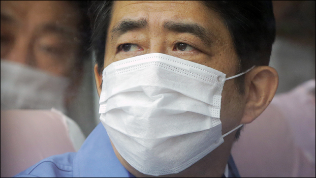 Japan's Prime Minister Shinzo Abe visits one of the Tokyo Electric Power Co. (Tepco) facilities at the crippled Fukushima nuclear power plant, 29 December 2012. Photo: Itsuo Inouye / AP