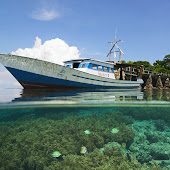 Boat on the Reef of Siladen Paket Tour Bunaken