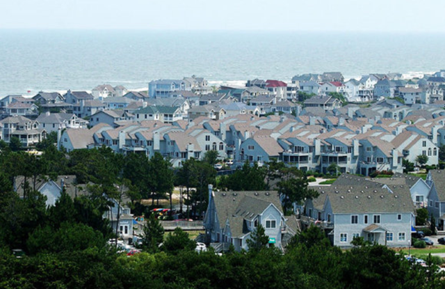 Rows of houses near the Currituck Beach Lighthouse, along the Atlantic coast in Corolla, on the Outer Banks of North Carolina. With virtually no debate, the state Senate nixed global warming restrictions on the state&rsquo;s coast, 12 June 2012. newsobserver.com