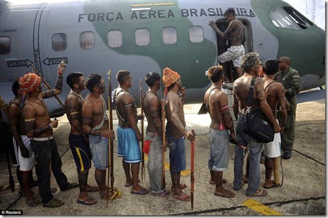 Munduruku Indians, many of whom are flying for the first time, board a Brazilian Air Force plane to fly to Brasilia, Brazil, for talks with the government, in Altamira, June 4 - Copy Munduruku Indians, many of whom are flying for the first time, board a Brazilian Air Force plane to fly to Brasilia, Brazil, for talks with the government, in Altamira, June 4 - Copy
