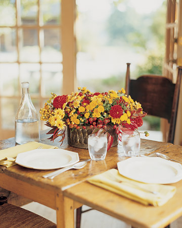 Mum and Rose Hips Arrangement: Pale-yellow 'Ginger' and orange 'Gold Strike' mums are made livelier by crimson dahlias; clusters of ruby-red rose hips gleam like jewels between the flowers. As a centerpiece, the display sets a cheerful tone for a weekend brunch. Mum and Rose Hips Arrangement: Pale-yellow 'Ginger' and orange 'Gold Strike' mums are made livelier by crimson dahlias; clusters of ruby-red rose hips gleam like jewels between the flowers. As a centerpiece, the display sets a cheerful tone for a weekend brunch.