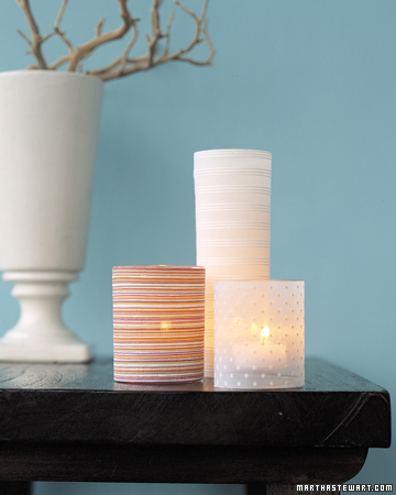 Candle slipcovers can easily be made by dressing a glass candleholder in a decorative fabric.