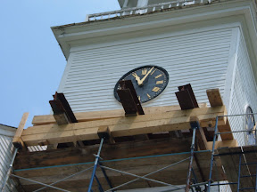 Structural staging supported I beams that were carefull threaded through the tower.