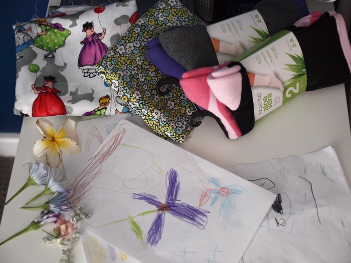 hand made cards, socks wrapped in fabric and flowers and foliage picked from the garden
