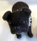 It looks a lot like you, Francesca!  If you send Jennifer a photo of your pet, she'll design a felted copy for you.  She constructs them out of wire frames and wool yarn.