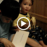Kai reading to Eidan, with Eidan providing sound effects Kai reading to Eidan, with Eidan providing sound effects