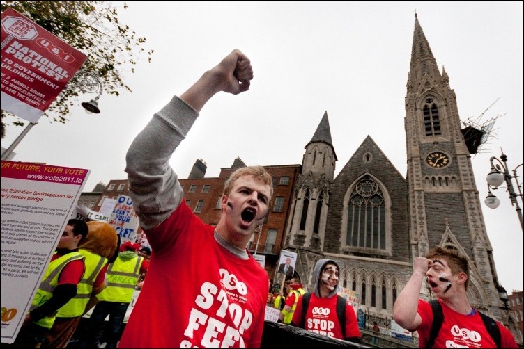 16/11/2011 -- ADV PHOTOJOURNALISM --  Stop the Fees Save the Grant Student March in Dublin; Parnell Square/Garden of Remembrance. The participant chants the slogas of indignation on planned cuts in university grants and rises of entrance fees. The march gathered over 15,000 students who marched from Parnell Square across the city center to demonstrate in front of government buildings. Photograph: Aleksander Szojda / DCU