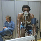 Excercise testing at Seneca, the sports science department of HAN
University in Nijmegen. Ethiopian Estifanos Gebresilassie from the Marco Polo Cycling Team at the bicycle ergometer. Team manager Gudo Kramer in the background. (photo: Nick Mitchell)