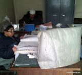 A government office in Afghanistan with an unused computer screen and paper records. A government office in Afghanistan with an unused computer screen and paper records.