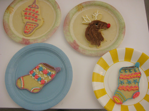 Adina decorated some stockings (it was her first time decorating Christmas cookies) and Dawn made Rudolph out of an angel cutout. She crushed a red M&M to make the nose. Adina decorated some stockings (it was her first time decorating Christmas cookies) and Dawn made Rudolph out of an angel cutout. She crushed a red M&M to make the nose.