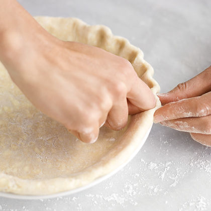 Tuck the overhang under itself to create a rim; press to seal. Crimp the rim with your thumb and forefinger, or press with the tines of a fork. Tuck the overhang under itself to create a rim; press to seal. Crimp the rim with your thumb and forefinger, or press with the tines of a fork.