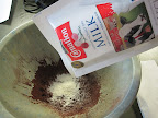 In goes the nonfat dry milk.